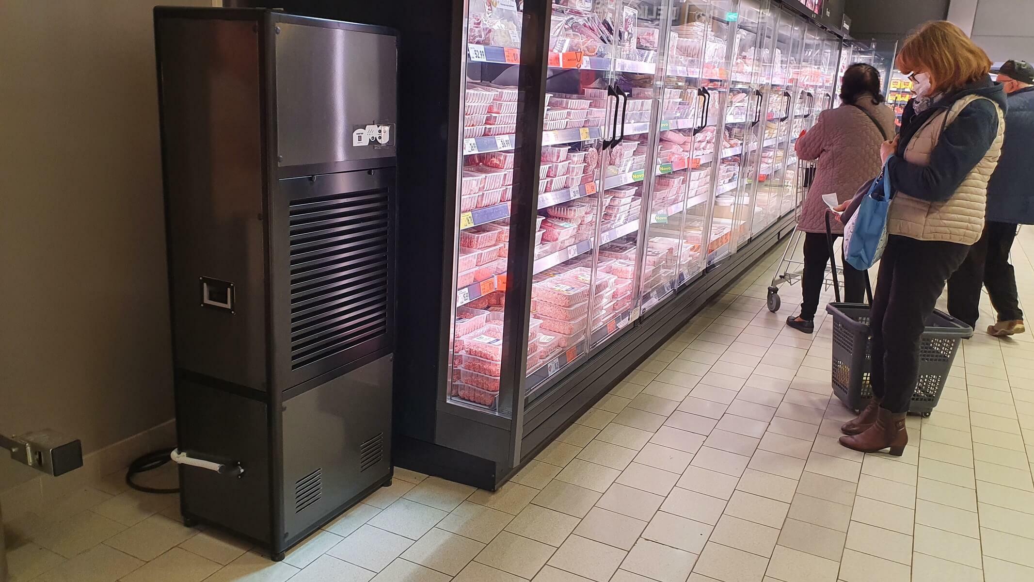 Photograph of freezer unit and Master dehumidifier unit in a supermarket food store - Infographic image