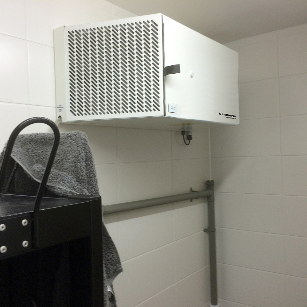 Calorex DH 15 industrial dehumidifier installed in a fire station drying room